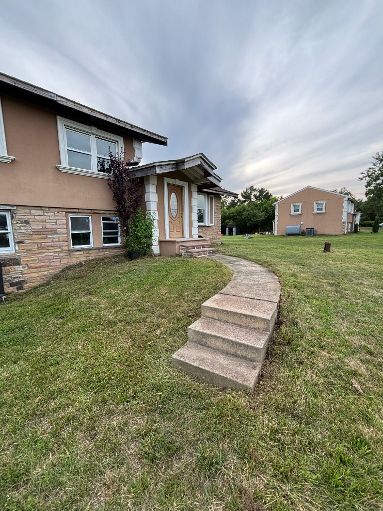 Clean front walkway and tidied lawn